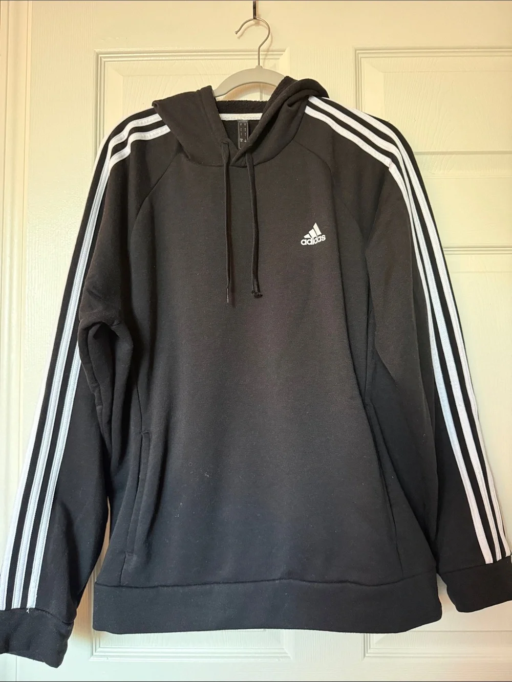 Adidas Black Hoodie with White Three-Stripe Sleeves